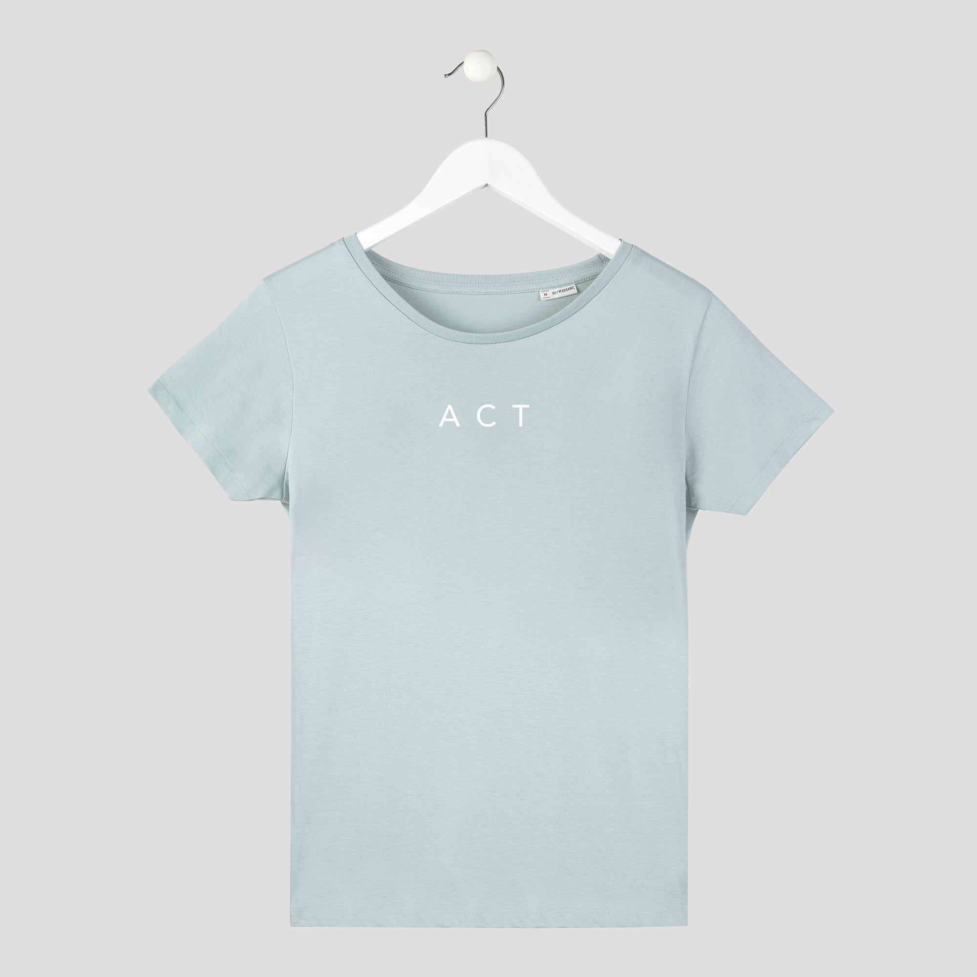 camiseta minimalista act now con letras finas actúa verde mujer
